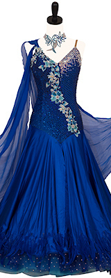 This is a photo of our Donna Inc Standard Dress, Vision in Blue. A beautiful blue ballroom dress with Swarovski stones that form a floral motif.