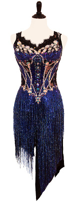 This is a photo of our dress Volta. Heavily stoned in Swarovski stones and beaded fringe, this Rhythm Latin dress is by Designs to Shine.